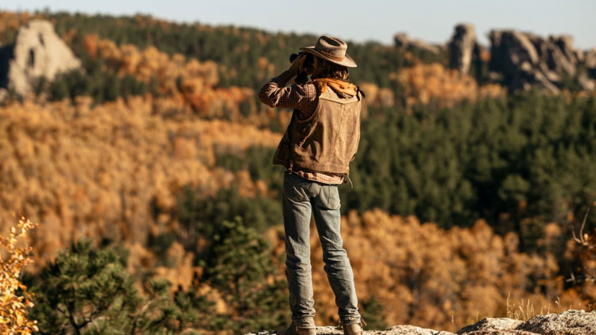 A cowboy shooting fall foliage in the Black Hills