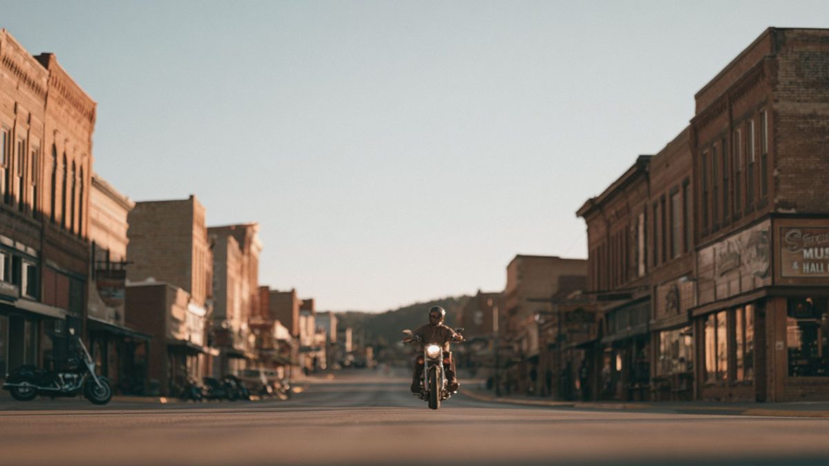 Lone motorcyclist riding the streets of downtown Sturgis SD