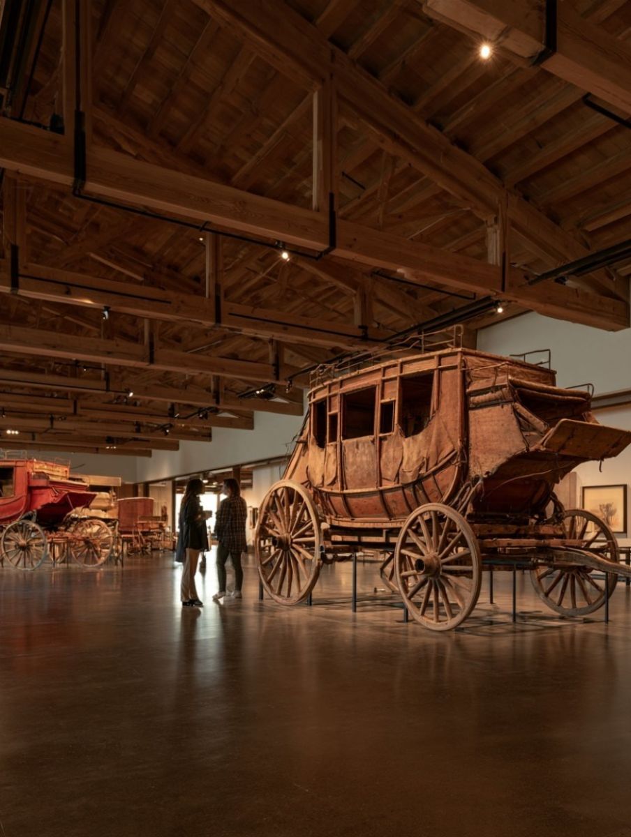 Original stagecoaches and red carriages on display at the Days of '76 Museum in Deadwood, South Dakota