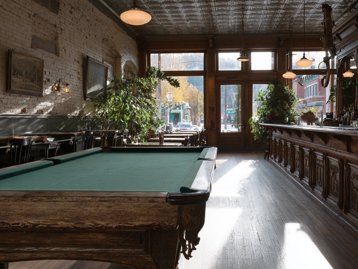 Sunlit historic saloon interior with a green-felt pool table and carved wood bar